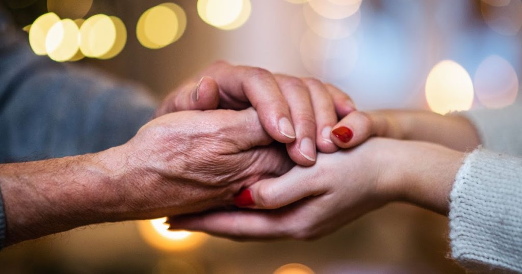 Holding hands in hospice care during the holidays