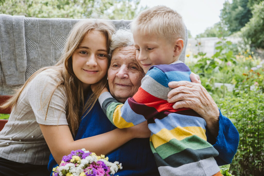 Family hugging each other as they ponder “what does it mean when someone is in hospice?”