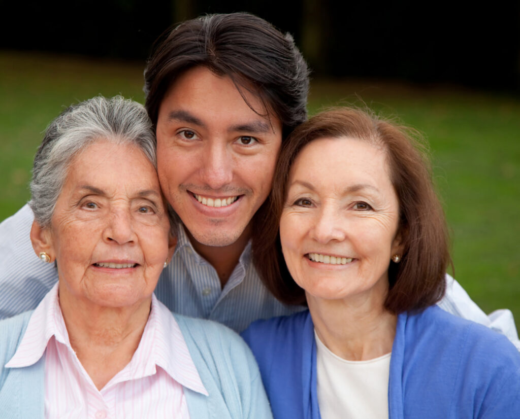 Smiling senior woman at a table discussing “what does it mean when someone is in hospice?”